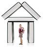 Isolated girl standing in front of building made out of books