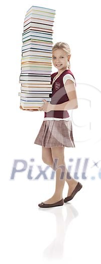 Isolated student girl carrying lots of books Isolated student girl carrying lots of books