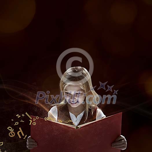Student girl reading magical book Student girl reading magical book