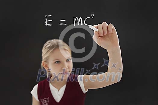 Student girl chalking mass–energy equivalence Student girl chalking mass–energy equivalence