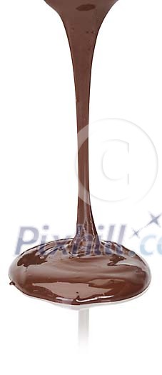 Isolated melted chocolate dripping on the table Isolated melted chocolate dripping on the table