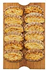 Isolated karelian pasty on a cutting board