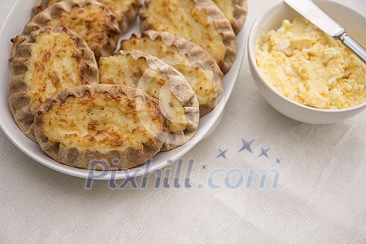 Karelian pasty with a bowl of egg butter Karelian pasty with a bowl of egg butter