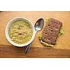 Bowl of soup with sandwich