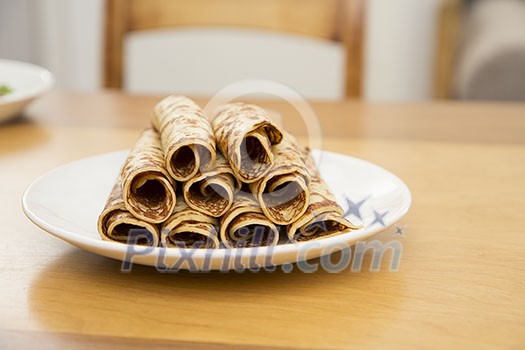 Rolls of pancakes on a plate Rolls of pancakes on a plate