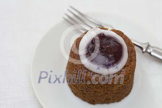 Runeberg torte on a plate with a fork Runeberg torte on a plate with a fork