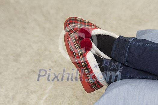 Relaxing feet in warm slippers Relaxing feet in warm slippers
