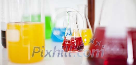 Coloured fluids in measuring glasses Coloured fluids in measuring glasses