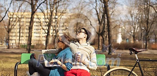 Couple sitting on the park bench Couple sitting on the park bench