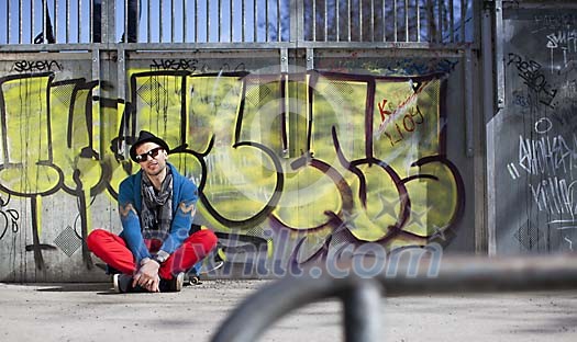 Hipster looking man in a skatepark Hipster looking man in a skatepark