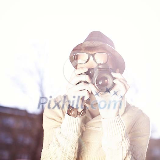 Man taking a picture with a camera Man taking a picture with a camera
