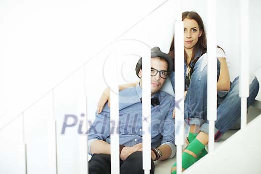 Couple sitting on the stairs Couple sitting on the stairs