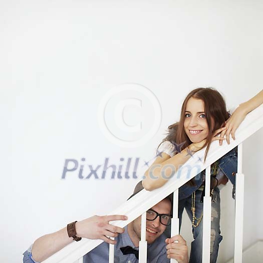 Couple having fun on the stairs Couple having fun on the stairs
