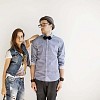 Couple posing by the wall