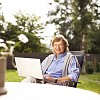 Man sitting outside with laptop