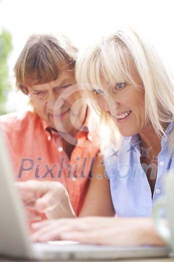 Couple typing on the laptop Couple typing on the laptop