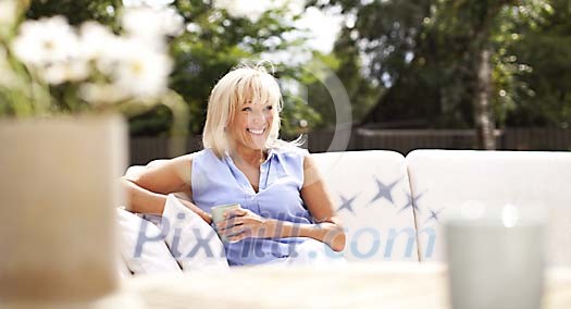 Woman sitting on the terrace Woman sitting on the terrace