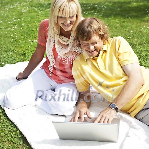 Couple enjoying time on the grass Couple enjoying time on the grass
