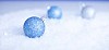 Blue christmas balls on the snow