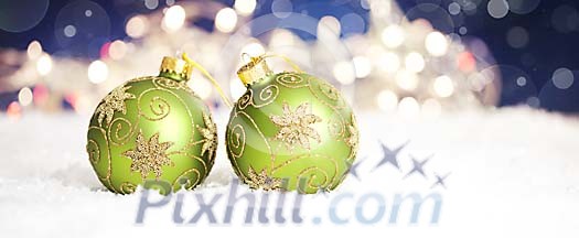 Green christmas balls on the snow Green christmas balls on the snow