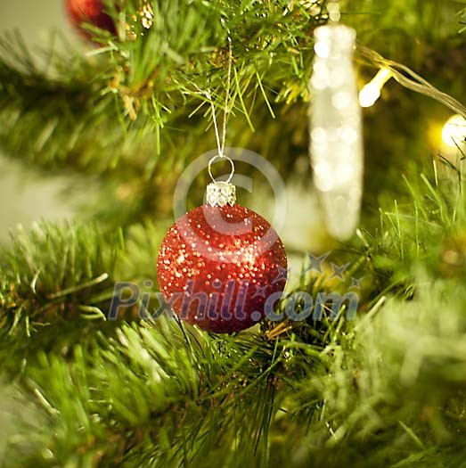 Red christmas ball on a christmas tree Red christmas ball on a christmas tree