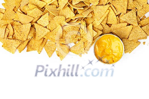 Nachos with cheese sauce on a white background Nachos with cheese sauce on a white background