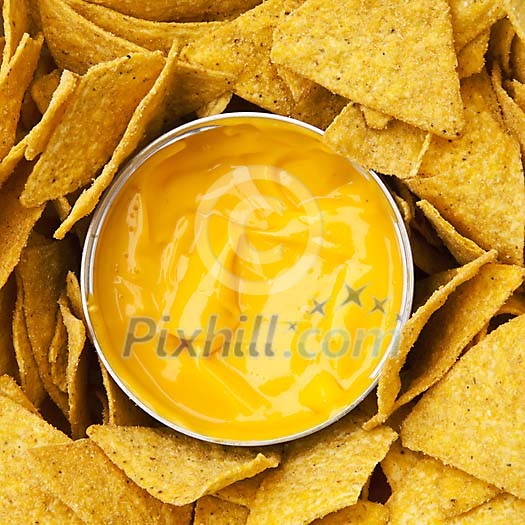Background of cheese sauce with nachos Background of cheese sauce with nachos