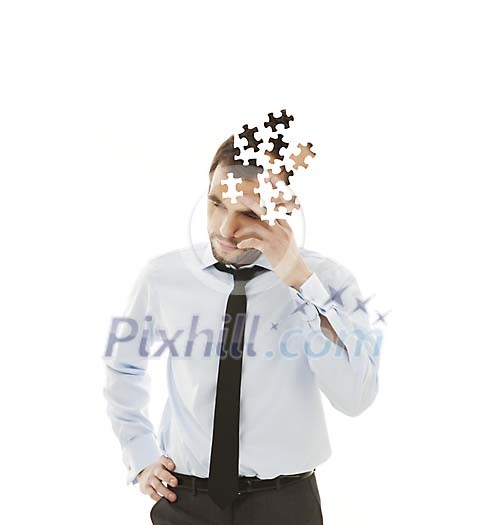 Businessmans head made of puzzle Businessmans head made of puzzle