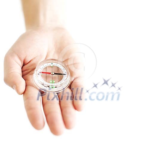 Hand holding a compass Hand holding a compass