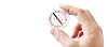 Isolated hand holding a see-through compass