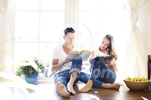 Couple reading by the window Couple reading by the window