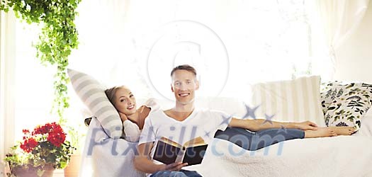 Young couple in the living room Young couple in the living room