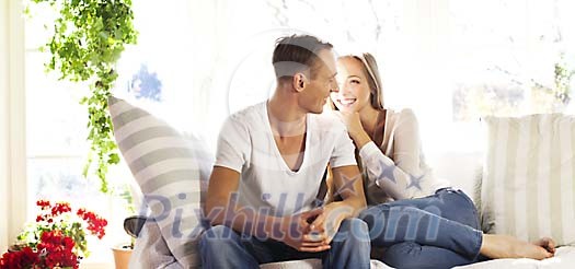 Young couple sitting on the sofa Young couple sitting on the sofa
