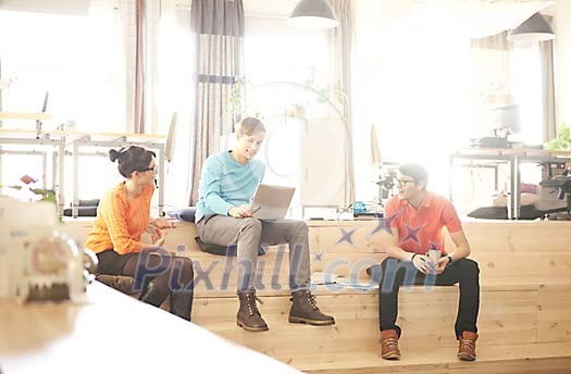 Men and a woman having a meeting in the office Men and a woman having a meeting in the office