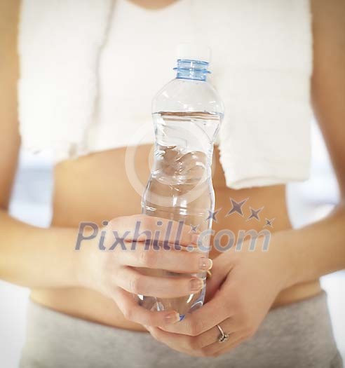Woman holding a water bottle Woman holding a water bottle