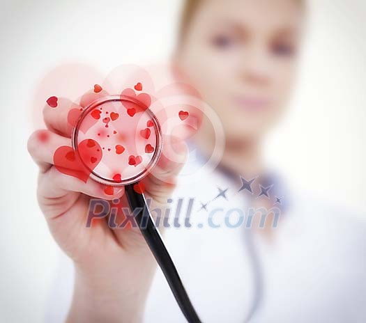 Closeup of a nurses hand holding a stetoscope with hearts on it Closeup of a nurses hand holding a stetoscope with hearts on it