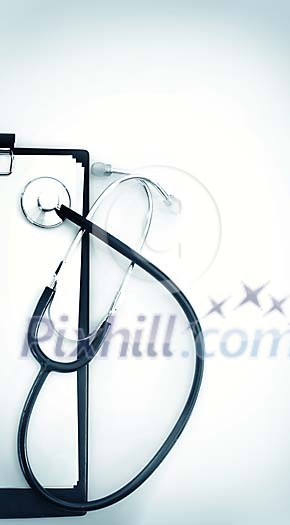 Stethoscope on an empty notepaper Stethoscope on an empty notepaper