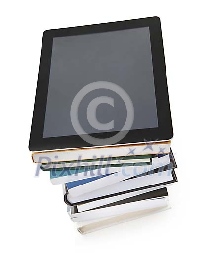 Isolated e-reader on a stack of books Isolated e-reader on a stack of books