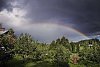 Dramatic sky and sunshine landscape result in beautiful rainbow