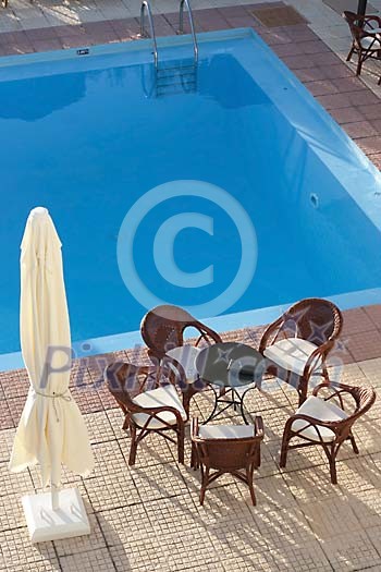 Table and chairs by the pool