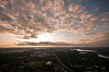 Parachuter above the town in the evening