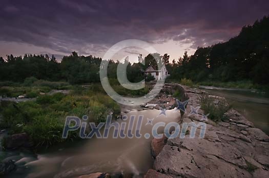 River flowing by the house ruins River flowing by the house ruins
