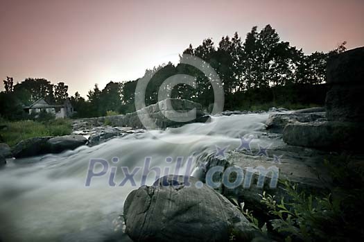 River rushing down a waterfall River rushing down a waterfall