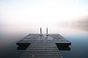 Pier on the misty lake