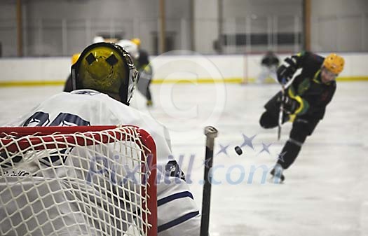 Ice hockey goalie and player Ice hockey goalie and player
