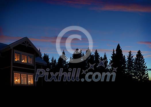 Lighted house in the evening dusk Lighted house in the evening dusk