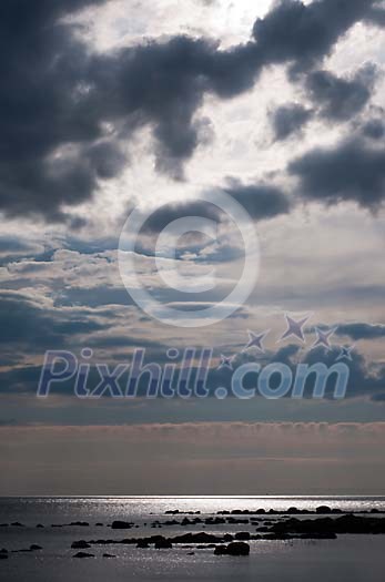 Clouds above the evening sea Clouds above the evening sea