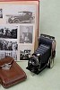 Old photo camera with black and white photo album