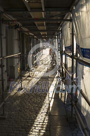 Street under the scaffolding Street under the scaffolding