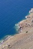 Deep blue sea and hillside shore